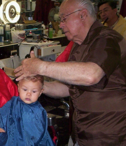 Sammy in barber chair showing face
